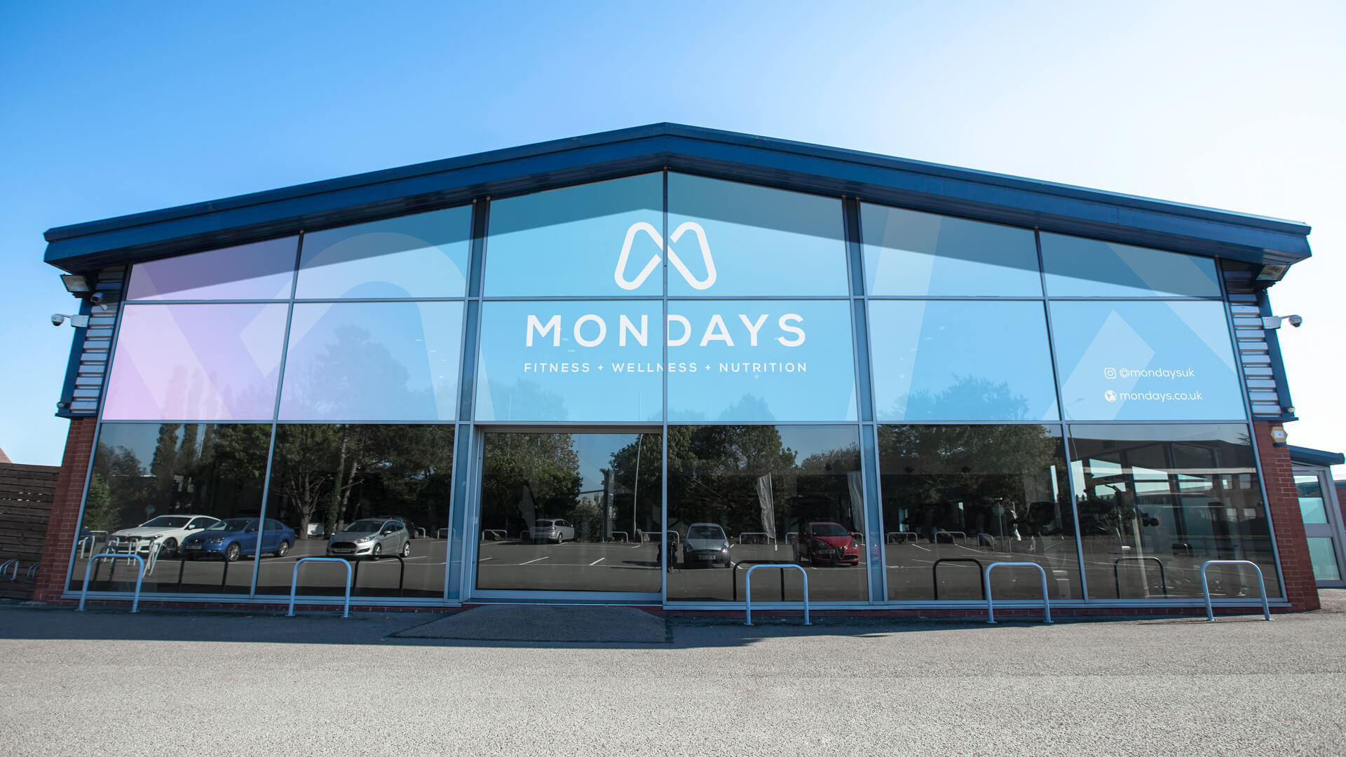 Mondays brand identity HQ office signage and spatial branding
