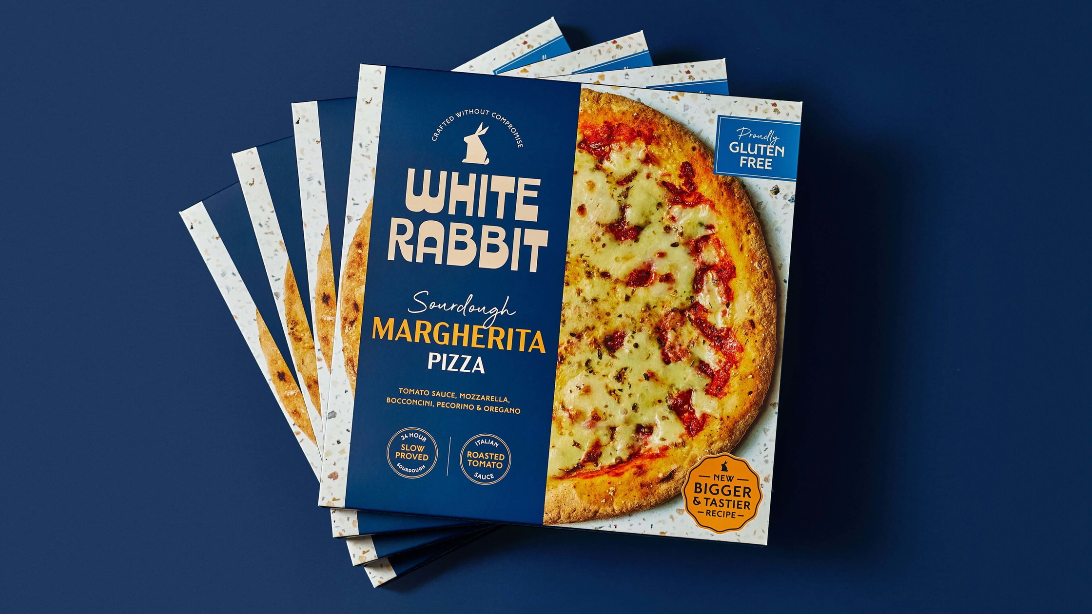 White Rabbit Pizza Co. packaging design featuring navy blue palette and refined typography