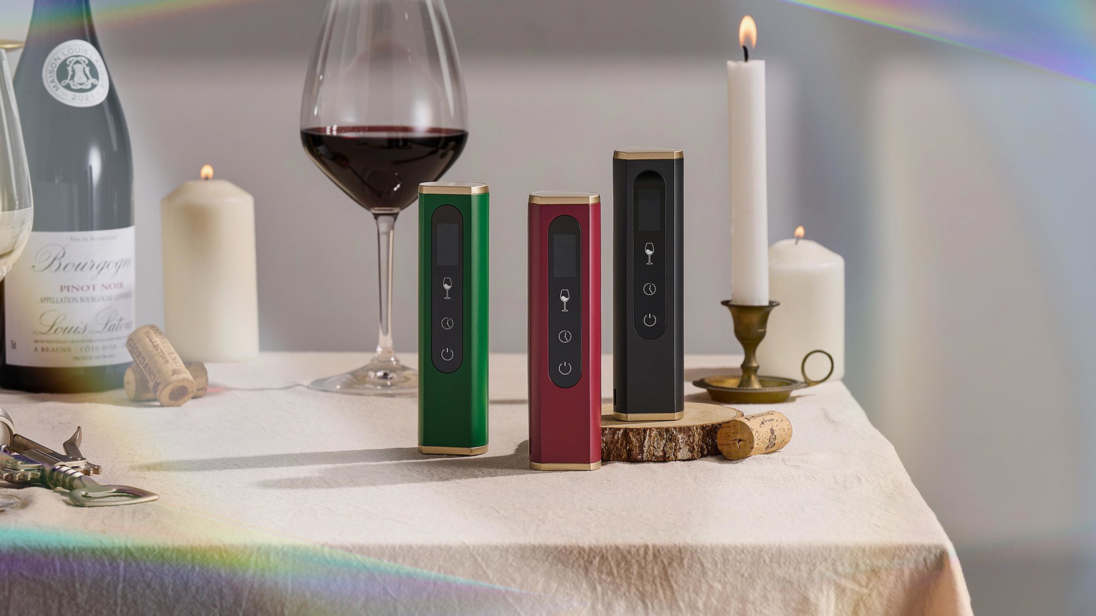 Kairos brand identity with three wine aerator units in promotional arrangement