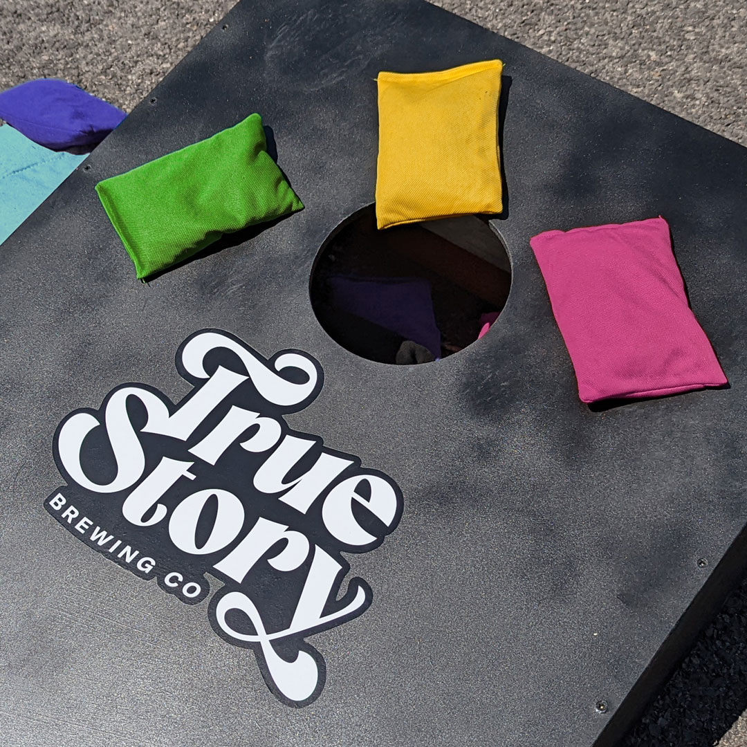 True Story Brewing Co. brand identity cornhole game set