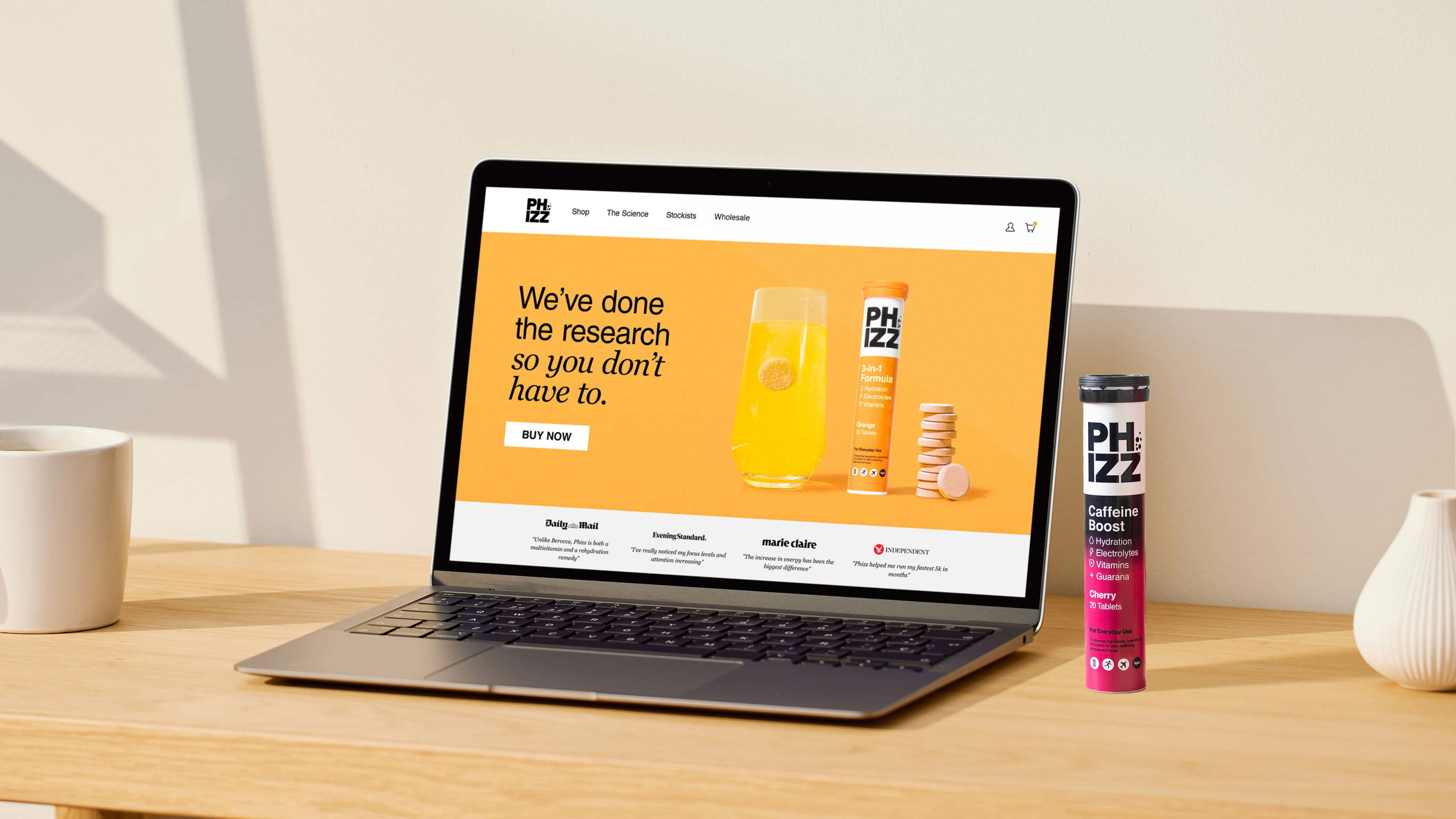 Phizz brand identity shown on MacBook website mockup